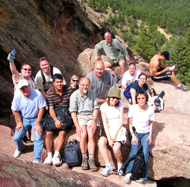 Nigel Bevans with other people posing for a picture on a mountain hike